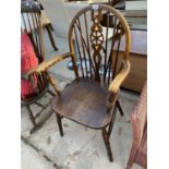 A WHEEL BACK OAK ARMCHAIR WITH ELM SEAT