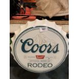 A 'COORS RODEO' BEER BOTTLE TOP MAN CAVE SIGN