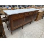 AN EMPIRE STYLE MAHOGANY SIDEBOARD ENCLOSING THREE DRAWERS AND THREE CUPBOARDS WITH BRASS BEADING