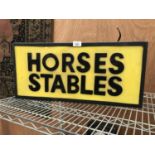 AN ILLUMINATED 'HORSES STABLES' LIGHT BOX SIGN