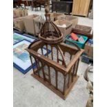 AN ORNATE WOODEN BIRDCAGE