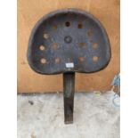 A VINTAGE LISTER TRACTOR/IMPLEMENT SEAT WITH MOUNTING BRACKET