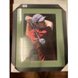 A FRAMED AND SIGNED COLOUR PHOTOGRAPH OF GOLFER JUSTIN ROSE COMPLETE WITH CERTIFICATE OF