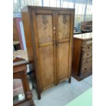 AN EARLY 20TH CENTURY OAK TWO DOOR GENTS WARDROBE