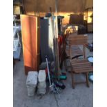 A PAIR OF WOODEN FOLDING GARDEN CHAIRS, VARIOUS TOOLS, TWO CONCERETE PEDASTELS AND A TREDMILL ETC