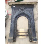 A CAST IRON FIRE SURROUND AND MANTLE