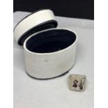 A SILVER RING WITH A SQUARE STONE IN A PRESENTATION BOX