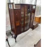 AN EDWARDIAN MAHOGANY AND INLAID BOWFRONTED DISPLAY CABINET BY SHAPLAND & PETTER ON CABRIOLE LEGS,