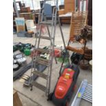 AN ELECTRIC FLYMO LAWNMOWER AND A SET OF WOOD AND METAL STEP LADDERS