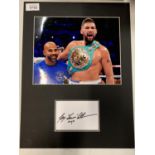 A MOUNTED COLOUR PHOTOGRAPH OF HEAVYWEIGHT BOXER TONY BELLEW AND HIS AUTOGRAPH COMPLETE WITH