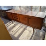 A S.F. (STONEHILL FURNITURE) RETRO TEAK SIDEBOARD ENCLOSING FOUR DRAWERS AND THREE CUPBOARDS, 77.