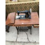 A SINGER TREDLE SEWING MACHINE