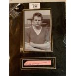 A PICTURE OF WILF MCGUINESS MANCHESTER UNITED WITH HIS AUTOGRAPH IN A MOUNT COMPLETE WITH