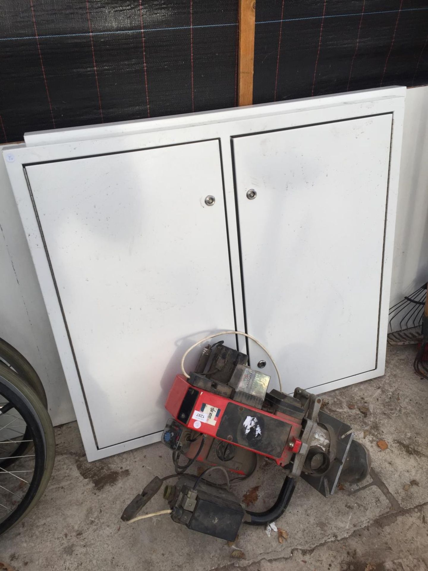 A KROMS SCHRODER PUMP AND A PAIR OF WHITE METAL DOUBLE DOORS