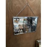 A VINTAGE METAL FRAMED WALL MIRROR WITH HANGING CHAIN