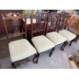 FOUR CARVED MAHOGANY DINING CHAIRS