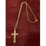 A 9 CARAT GOLD CROSS AND CHAIN 8.6G
