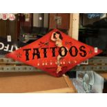 A METAL DIAMOND SHAPED TATTOOS AND PIERCINGS' SIGN