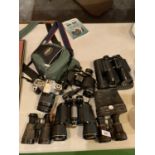 FIVE PAIRS OF BINOCULARS AND A CAMERA AND CAMERA BAG