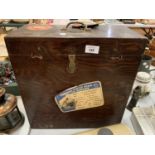 A VINTAGE WOODEN TRAVELLING CASE WITH ORIGINAL LABELS THAT SAILED FROM NEW YORK TO SOUTHAMPTON ON