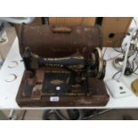 A VINTAGE SINGER SEWING MACHINE WITH CASE