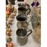 A GROUP OF FOUR PEWTER TANKARDS