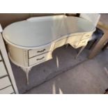 A FRENCH STYLE CREAM DRESSING TABLE WITH FIVE DRAWERS