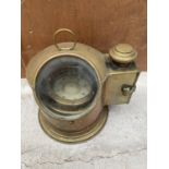 A VINTAGE SESTREL MARITIME COMPASS IN A BRASS CASE WITH BRASS SIDE COMPARTMENT FOR OIL LAMP