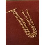 A 9 CARAT GOLD ALBERT CHAIN WITH T BAR WEIGHT 34G