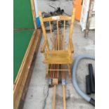 A SMALL WOODEN DOLLS CHAIR AND A WOODEN EASEL