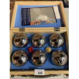 AN UNUSED WOODEN BOXED SET OF BOULES