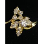 A DECORATIVE ABSTRACT DESIGN 18 CARAT GOLD DIAMOND CLUSTER RING 3.47G APPROXIMATELY 60 PTS SIZE: O