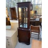 A MAHOGANY CORNER CABINET WITH LOWER DOOR AND UPPER GLAZED DOOR