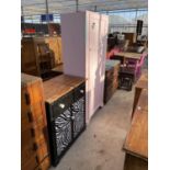 A BLACK AND WHITE PAINTED TALLBOY AND A PINK PAINTED WARDROBE