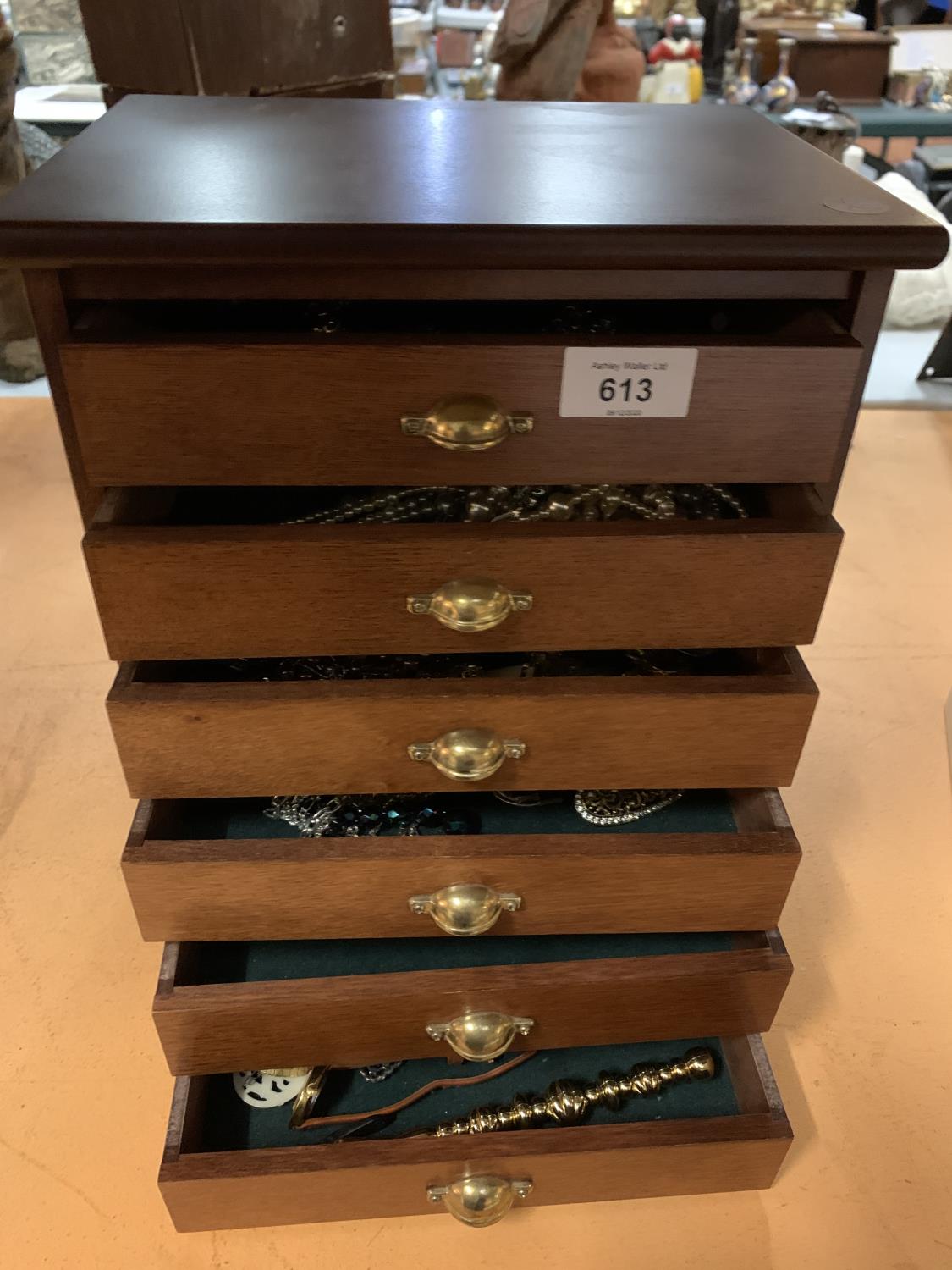 A SIX DRAWER JEWELLERY BOX AND CONTENTS