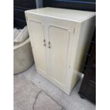 A CREAM AND GILT TWO DOOR MODERN WARDROBE, 33" WIDE