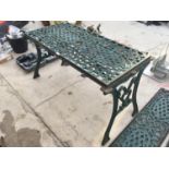 A CAST IRON TABLE WITH DECORATIVE CAST IRON ENDS