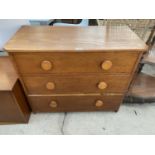 AN OAK CHEST OF THREE DRAWERS