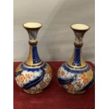 A PAIR OF MACINTYRE VASES (HAVE BEEN RESTORED HAD CHIPS TO RIM)