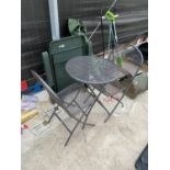 A METAL GARDEN TABLE AND CHAIRS, A PLASTIC LOUNGER AND A PARASOL