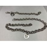 A MATCHING SILVER NECKLACE AND BRACLET WITH A HEART CHARM ON EACH MARKED 925 ON CHAIN AND CHARM