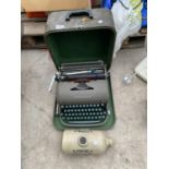 A VINTAGE REMINGTON TYPEWRITER AND A STONEWARE HOT WATER BOTTLE