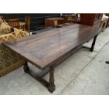 A GEORGE III STYLE OAK REFECTORY TABLE ON TURNED SUPPORTS - 108" V 40"