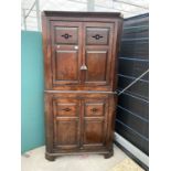 A GEORGE III OAK FOUR DOOR FULL LENGTH CORNER CUPBOARD WITH PIERCED AND PANELLED DOORS, 41" WIDE,