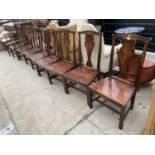 A SET OF EIGHT ELM GEORGIAN STYLE DINING CHAIRS, TWO OF WHICH BEING CARVED, ALL HAVING VASE SHAPED