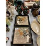 A PAIR OF FRAMED CERAMICS DIPICTING A WOMAN WITH FLORAL HEAD DRESSING
