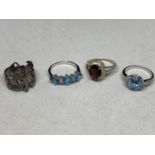 FOUR VARIOUS SILVER RINGS TO INCLUDE PALE BLUE STONE AND CLEAR CHIP EXAMPLES ETC