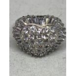 AN 18 CARAT WHITE GOLD CLUSTER RING SET WITH NINETEEN ROUND BRILLIANT CUT DIAMONDS AND THIRTY TWO