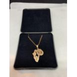 A 9 CARAT GOLD NECKLACE WITH A PENDANT OF AFRICA IN A PRESENTATION BOX