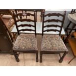 TWO OAK LADDER BACK DINING CHAIRS AND A FORMICA TOPPED COFFEE TABLE